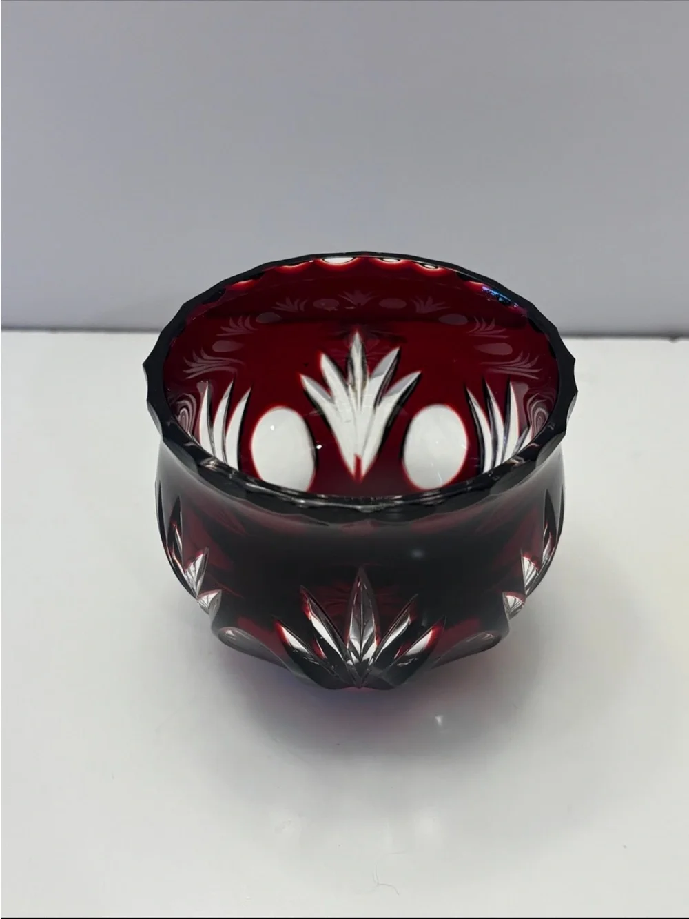 Bohemian Red Crystal glass votive candle holder features intricate cut-to-clear